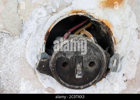 old defective toggle switch with metal flush-mounted box Stock Photo