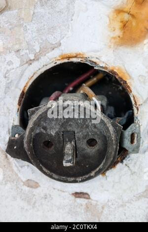 old defective toggle switch with metal flush-mounted box Stock Photo