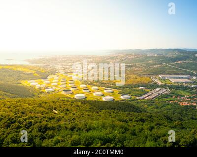 Oil tanks in industrial zone near Trieste, Italy Stock Photo