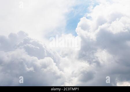 Gray and white fluffy clouds in the pale sky. Beautiful sky Stock Photo