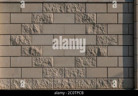 White grey brick wall concrete texture. Grunge, cement. Seamless texture with yellow rhombus pattern. Stock Photo