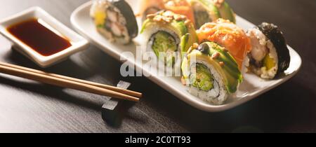 Sushi roll set on plate. Japanese Asian traditional food front view Stock Photo