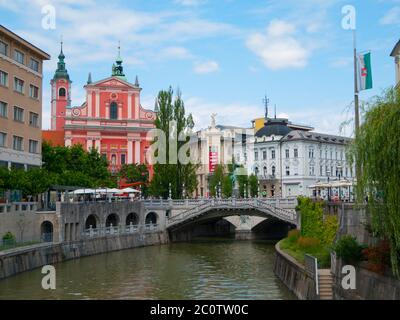 Ljubljana city center and river Ljubljanica with Triple Bridge and Franciscan Church of the Annunciation, Slovenia Stock Photo