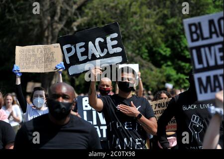 Black Lives Matter peaceful protest in Pittville Park in the shadow of Pittville Pump Room the iconic Regency building. The crowd were peaceful and re Stock Photo