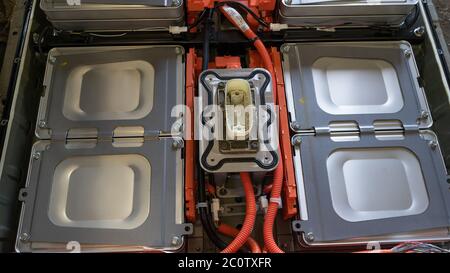 Cells of high voltage electric car batterie. Demounted battery from Nissan Leaf vehicle with zero emission. Green transport concept. Close up shot Stock Photo