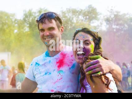 Happy couple in love on holi color festival Stock Photo