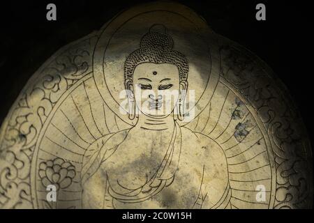 Lovely background image depicting an ancient engraving of the Buddha (very shallow depth of field)  N Stock Photo