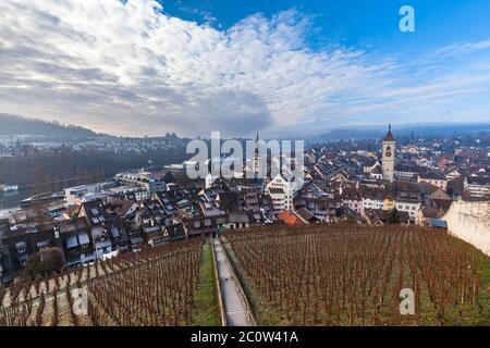 Aerial panorama view of old town cityscape of Schaffhausen and the Rhine river from the Munot fortification in autumn on sunny day with blue sky cloud Stock Photo