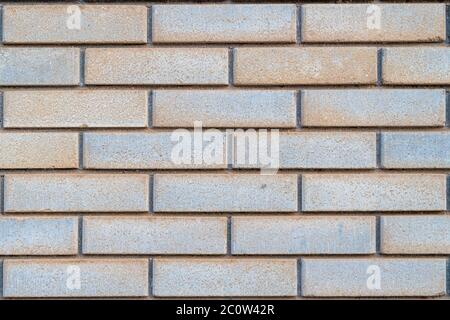 Beige-brown grunge brick wall texture or old surface pattern for background and backdrop, cream tone design element and building material in urban con Stock Photo