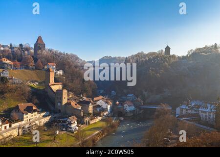 Stunning panorama view of Bern Bridge, Bern Gate, Gotteron Bridge with river, Sarine river flowing in the valley on a sunny winter day from Zaehringen Stock Photo