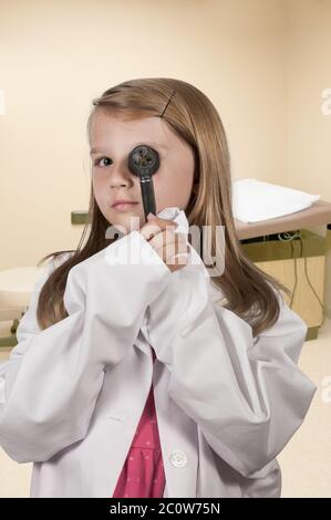 Child doctor with an otoscope Stock Photo