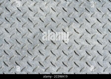 Metal diamond tread plate background in silver gray color Stock Photo