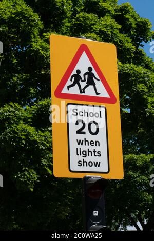 20 mph road sign by school. West Midlands. UK Stock Photo