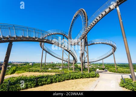 DUISBURG, GERMANY - JULY 03, 2018: Tiger and Turtle or Magic Mountain is an art installation and landmark in Angerpark, Duisburg city in Germany Stock Photo