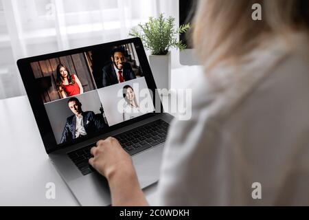 Back view of businesswoman speak using Webcam conference on laptop  Stock Photo