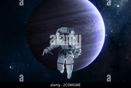 Astronaut on background of Jupiter. Solar system Stock Photo