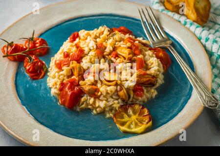 Mussels in wine sauce pilaf. Stock Photo