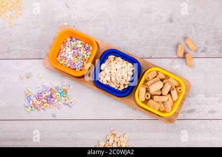 Mix nuts and chips on wooden table, Stock Photo