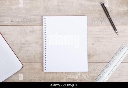 Notepad and pen on wooden table Stock Photo