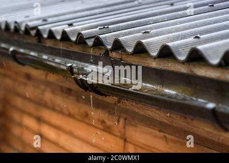rain flows down from the roof Stock Photo