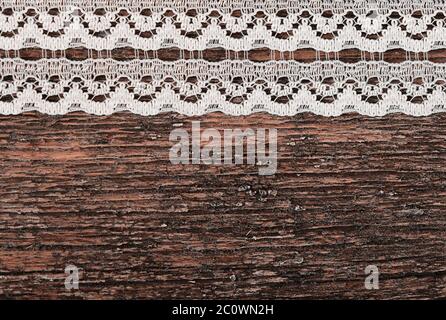 Openwork lace on wooden background Stock Photo