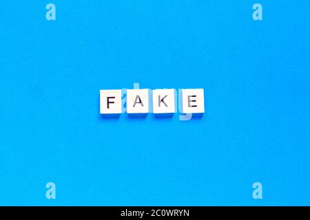 Fake word alphabet letters on blue background. flat layout. top view. Stock Photo
