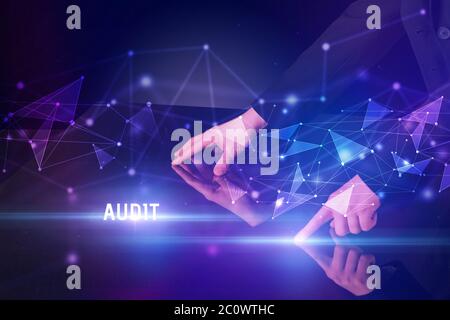 Businessman touching huge screen with AUDIT inscription, modern technology business concept Stock Photo