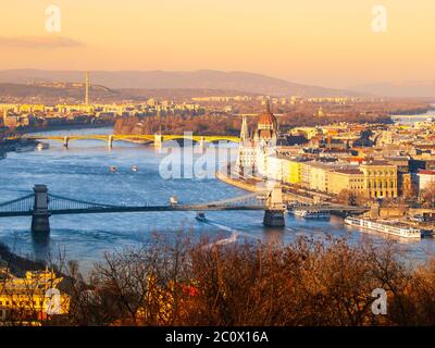Budapest cityscape with Parliament and Chain Bridge at sunset time, Hungary.