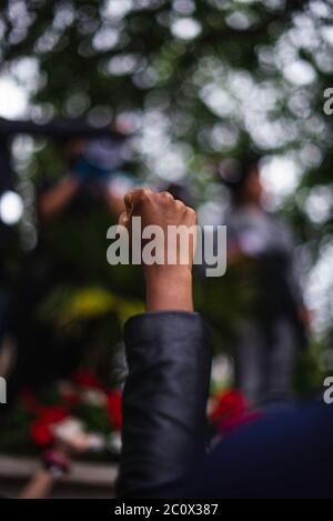 London, England, UK. 6th June, 2020.  BLM march organiser, Protestor hold a fist in the air to show solidarity . Hundreds of people joined the protest Stock Photo