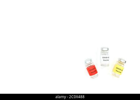 Covid-19 vaccine vials isolated in white background with copy space. Minimalist top view. Stock Photo