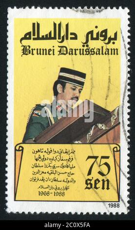 BRUNEI - CIRCA 1988: crowning of Sultan Hassanal Bolkiah. Reading from the koran, circa 1988. Stock Photo