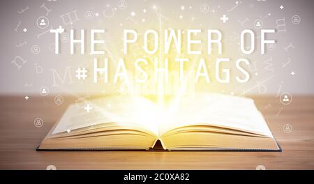 Open book with THE POWER OF #HASHTAGS inscription, social media concept Stock Photo