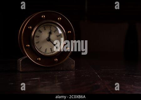 vintage alarm clock on table Stock Photo