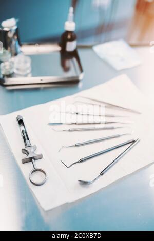 Dentist tools on the table in the office - treatment and prosthetics Stock Photo