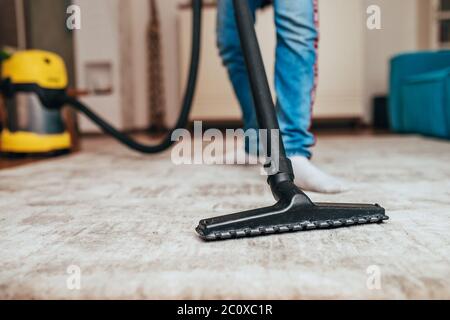 Dry cleaning of carpeting - washing vacuum cleaner on the carpet during cleaning Stock Photo