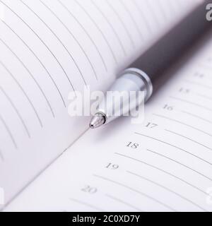 Ballpoint pen on notebook Stock Photo