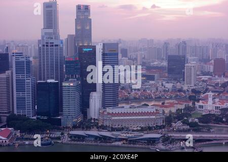 Aerial view of sunset over skyline of Singapore's downtown viewed from Marina Bay Sands Hotel's terrace. Singapore Stock Photo