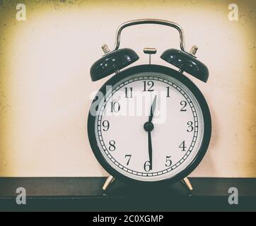 retro alarm clock on table Stock Photo
