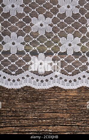 Openwork lace on wooden background Stock Photo