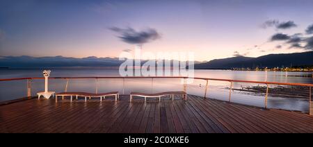 Blue hour sunrise scenic panorama from the popular, Cairns Esplanade boardwalk viewing platform on Far North Queensland coastline. Stock Photo