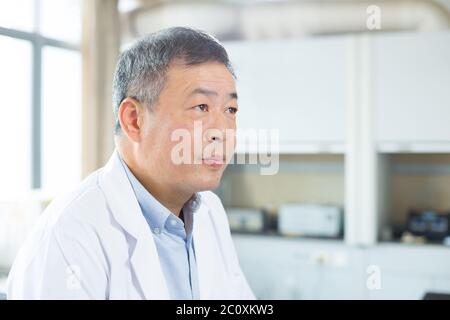man doing chemical experiment Stock Photo