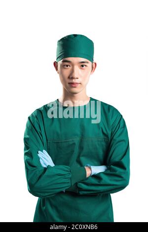 isolated asian young man doctor in green on white background Stock Photo