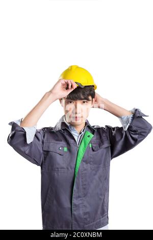 isolated young handsome asian technician on white background Stock Photo