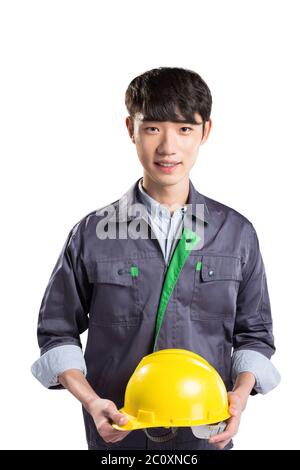 isolated young handsome asian technician on white background Stock Photo
