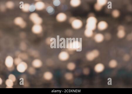 Blurry lights of urban Christmas illumination. Creammy bokeh, abstract background Stock Photo