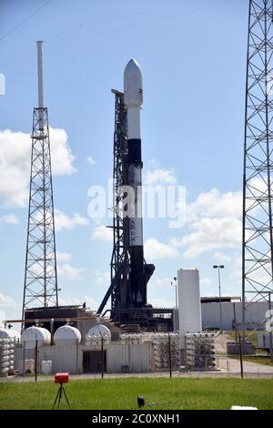 Cape Canaveral, Florida, USA. 12th June 2020. A SpaceX Falcon 9 rocket is being prepared for launching the company's next batch of 60 Starlink satellites to orbit from Complex 40 at the Cape Canaveral Air Force Station on Friday, June 12, 2020. The early morning launch, scheduled for 13 June, will be the third conducted by SpaceX in under a month. Photo by Joe Marino/UPI Credit: UPI/Alamy Live News Stock Photo