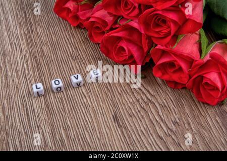 Cubes as a inscription love on a wooden background Stock Photo