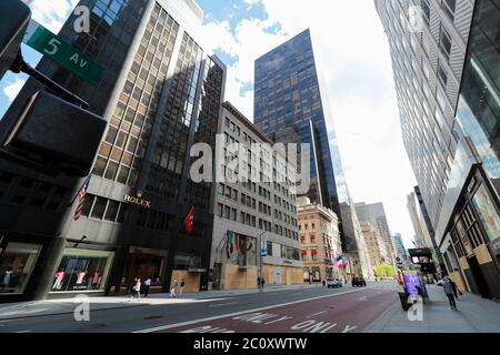 New York, USA. 12th June, 2020. A few vehicles and pedestrians are seen on Fifth Avenue during the Phase one reopening in New York, the United States, June 12, 2020. Credit: Wang Ying/Xinhua/Alamy Live News Stock Photo