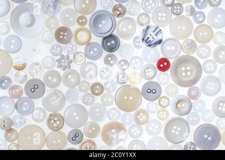 Lots of different colored and shaped buttons on a white background Stock Photo