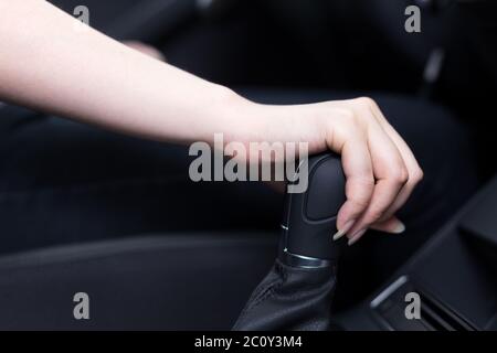 woman shift gears in car Stock Photo
